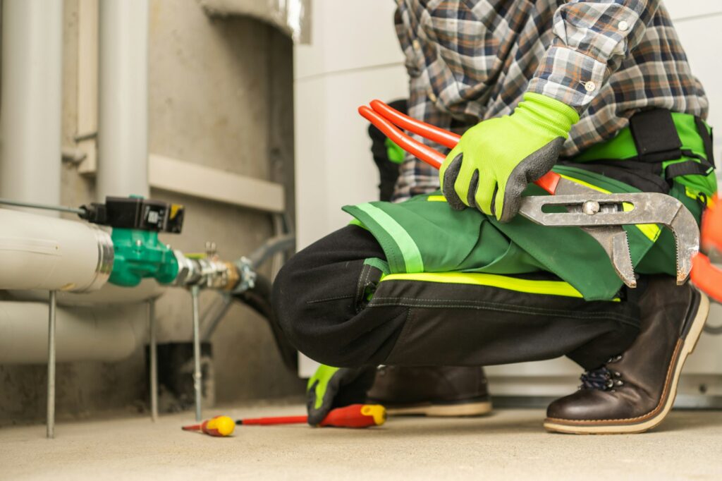 Plumbing Contractor Doing Necessary Fixes To the Heating Installation